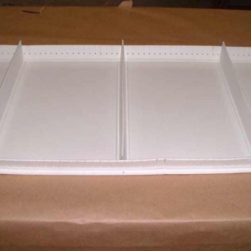 Perfils blancs de contenció per a bandes transportadores