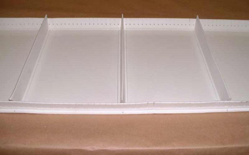 Perfiles blancos de contención para bandas transportadoras